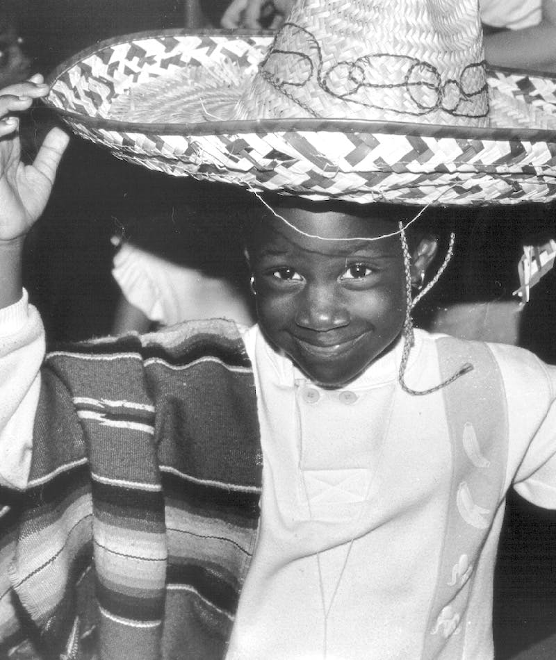 Young child posing in the Mexico Exhibit from Capital Children's Museum