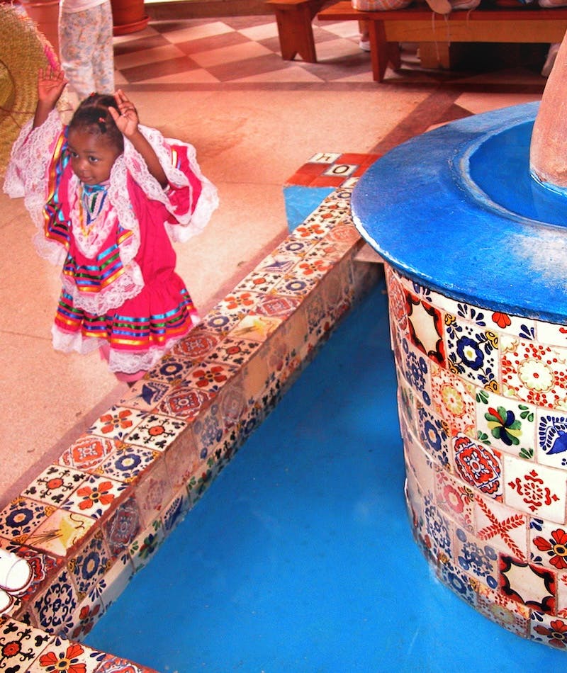 Young girl near the fountain in the Mexico Exhibit from Capital Children's Museum
